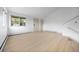 Open living area featuring wood floors, white walls and ample natural light at 1000 Zang St, Golden, CO 80401