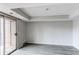 Bedroom with sliding door access to private balcony offers tray ceiling at 4899 S Dudley St # 15B, Littleton, CO 80123