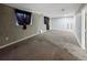 Unfinished carpeted basement with painted walls and minimal lighting at 4777 S Olathe St, Aurora, CO 80015