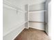 A walk-in closet features carpeting, shelving and rod for hanging clothes at 4777 S Olathe St, Aurora, CO 80015