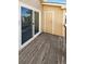 Enclosed wooden deck with sliding glass doors and a storage closet at 1885 S Quebec Way # H27, Denver, CO 80231
