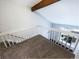 Bright hallway with wood trim and a white railing overlooking the first floor at 1885 S Quebec Way # H27, Denver, CO 80231