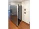 Kitchen featuring stainless steel refrigerator and white pantry cabinets at 1885 S Quebec Way # H27, Denver, CO 80231