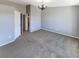 The room has neutral walls and carpet at 1885 S Quebec Way # H27, Denver, CO 80231