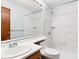 Clean bathroom with marble-tiled shower and updated vanity at 7820 W 87Th Dr # A, Arvada, CO 80005