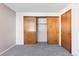 Bedroom with double-door closet and neutral decor at 7820 W 87Th Dr # A, Arvada, CO 80005