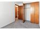 Bedroom with double doors leading to a large closet at 7820 W 87Th Dr # A, Arvada, CO 80005