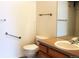 Bathroom featuring a single vanity and a toilet with accessibility bars at 3220 Boulder Cir # 103, Broomfield, CO 80023