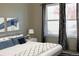Serene bedroom with a large window, modern decor, and comfortable-looking bed at 3220 Boulder Cir # 103, Broomfield, CO 80023