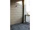 View of a porch featuring weathered shingle siding and railings, with a glimpse of a yard beyond at 3220 Boulder Cir # 103, Broomfield, CO 80023
