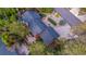 Aerial view of a single-Gathering home showing the roofline, mature trees, and surrounding landscaped areas at 19 Rock Ln, Castle Rock, CO 80104