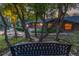 Inviting backyard view with mature trees, landscaping, and stone pathway at 19 Rock Ln, Castle Rock, CO 80104