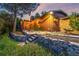 The home boasts a charming, stone accented backyard and stone steps to the wooden deck at 19 Rock Ln, Castle Rock, CO 80104