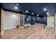Finished basement with hardwood floors, recessed lighting, and french doors at 19 Rock Ln, Castle Rock, CO 80104