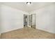 Bright bedroom featuring tile floors, white walls, decorative molding, and a closet at 19 Rock Ln, Castle Rock, CO 80104