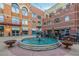 Outdoor courtyard with a large turquoise fountain, surrounding tables, and string lights at 19 Rock Ln, Castle Rock, CO 80104