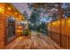 Spacious wooden deck features iron railings and string lighting, ideal for entertaining at 19 Rock Ln, Castle Rock, CO 80104