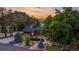 Exterior view of a home with mature trees and mountain views at 19 Rock Ln, Castle Rock, CO 80104