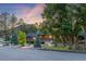 Lovely exterior view of the home with mature trees and professional landscaping at 19 Rock Ln, Castle Rock, CO 80104