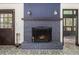 The blue brick fireplace with its rustic charm enhances the room's character and provides a cozy atmosphere at 19 Rock Ln, Castle Rock, CO 80104