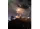 Brilliant fireworks display illuminating the night sky over a rocky landscape at 19 Rock Ln, Castle Rock, CO 80104