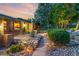 Charming walkway with stone accents leads to the inviting home with a vibrant green door at 19 Rock Ln, Castle Rock, CO 80104