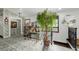 Hallway featuring colorful patterned wallpaper, decorative flooring, and a glass table with a willow tree at 19 Rock Ln, Castle Rock, CO 80104