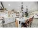 Spacious kitchen with island and bar stools, unique tiling, and stainless steel appliances at 19 Rock Ln, Castle Rock, CO 80104
