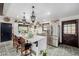 Spacious kitchen with island and bar stools, stainless steel appliances, and tile floors at 19 Rock Ln, Castle Rock, CO 80104