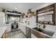 Bright kitchen view featuring stainless steel appliances, tile floor, and updated cabinetry at 19 Rock Ln, Castle Rock, CO 80104