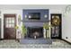 Living room with a painted brick fireplace and decorative flooring, a space that is cozy and inviting at 19 Rock Ln, Castle Rock, CO 80104