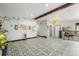 Bright and airy living space with hardwood floors, floral wallpaper, and large windows, perfect for a cozy atmosphere at 19 Rock Ln, Castle Rock, CO 80104