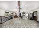Expansive living space showcases an open floor plan with dining, kitchen, and living room under one roof at 19 Rock Ln, Castle Rock, CO 80104