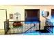Staircase with decorative wrought iron railings and a contrasting color tread at 19 Rock Ln, Castle Rock, CO 80104