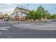 Street view of a roundabout with white buildings and flowers at 19 Rock Ln, Castle Rock, CO 80104
