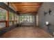 Bright sunroom with wood ceiling, tiled floor and walls of windows providing abundant natural light at 19 Rock Ln, Castle Rock, CO 80104