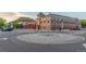 Exterior view of a red brick building and crosswalk surrounded by a view of a castle-like peak at 19 Rock Ln, Castle Rock, CO 80104
