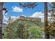 Scenic view of a rocky mountaintop under a blue sky with scattered clouds at 19 Rock Ln, Castle Rock, CO 80104