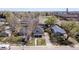 Aerial view showcases this home's location in a quiet neighborhood with mature trees and nearby amenities at 5612 Ammons St, Arvada, CO 80002