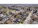 Community aerial view shows neighborhood with schools and open green spaces at 5612 Ammons St, Arvada, CO 80002