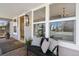 Inviting front porch with bench seating, offering a cozy spot to enjoy the outdoors at 5612 Ammons St, Arvada, CO 80002