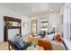 Inviting living room with decorative fireplace and comfortable seating, perfect for relaxing at 5612 Ammons St, Arvada, CO 80002