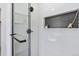 Contemporary shower with subway tile, a built-in niche, and modern fixtures for a spa-like experience at 5612 Ammons St, Arvada, CO 80002