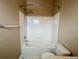 Clean bathroom features a tub/shower with white tile and modern fixtures at 19246 E Idaho Pl # 102, Aurora, CO 80017
