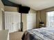 Bedroom with a ceiling fan, window, carpet, bed and two closets at 19246 E Idaho Pl # 102, Aurora, CO 80017