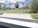 View of townhomes with garages and parking, showcasing the community's layout and green spaces at 19246 E Idaho Pl # 102, Aurora, CO 80017