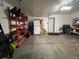 Spacious garage offers ample storage with shelving and accommodates a refrigerator at 19246 E Idaho Pl # 102, Aurora, CO 80017