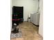 Cozy laundry area featuring modern washer and dryer, complemented by a storage area and decor at 19246 E Idaho Pl # 102, Aurora, CO 80017