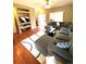 Comfortable living room with a large sectional sofa, plush rug, and built-in shelving at 19246 E Idaho Pl # 102, Aurora, CO 80017