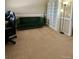 Living room showing carpet, couch, and built in shelving at 19246 E Idaho Pl # 102, Aurora, CO 80017